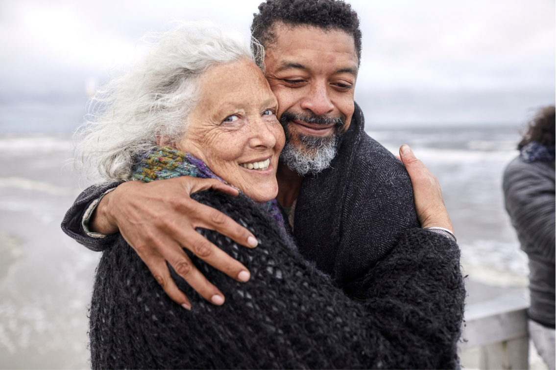 55+ couple embracing 